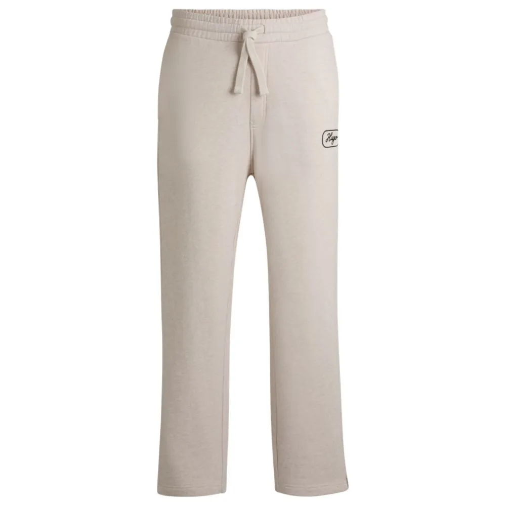 Cotton-terry tracksuit bottoms with embroidered graphics