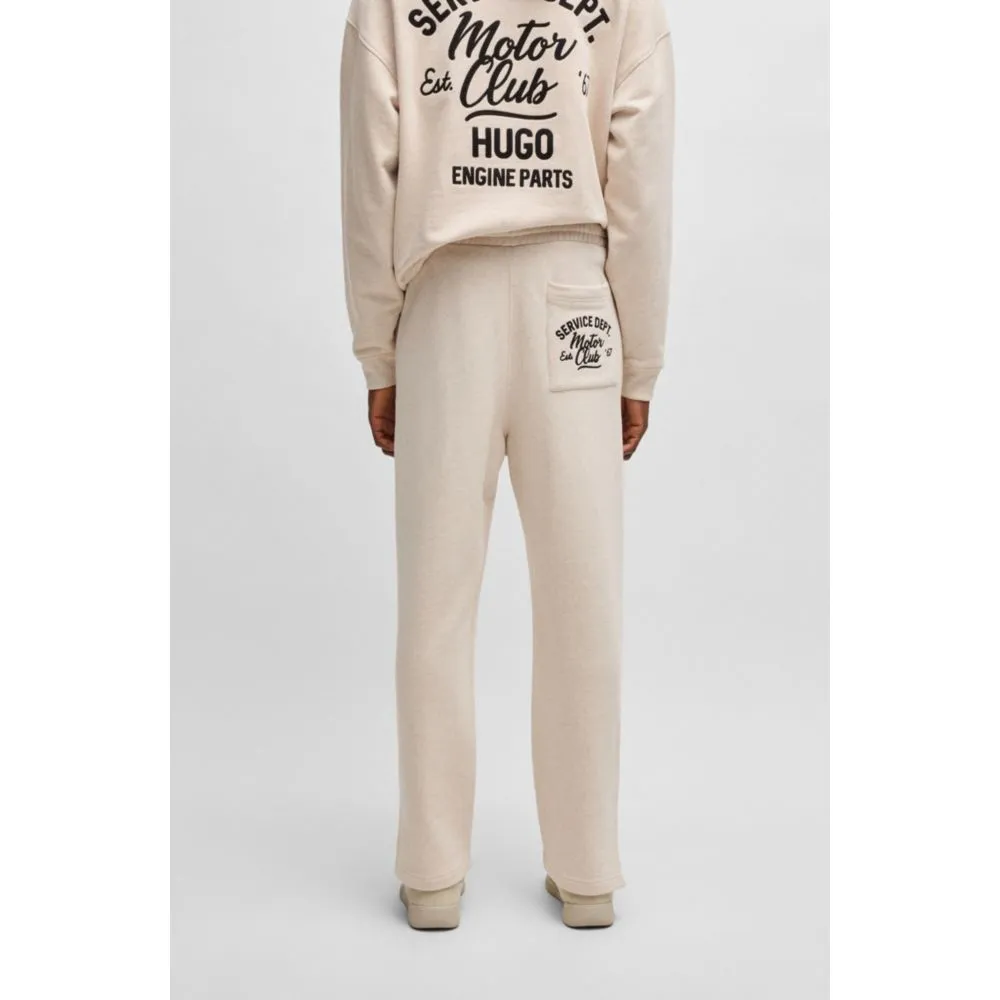 Cotton-terry tracksuit bottoms with embroidered graphics