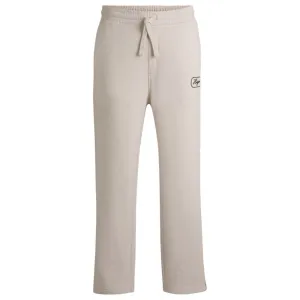 Cotton-terry tracksuit bottoms with embroidered graphics