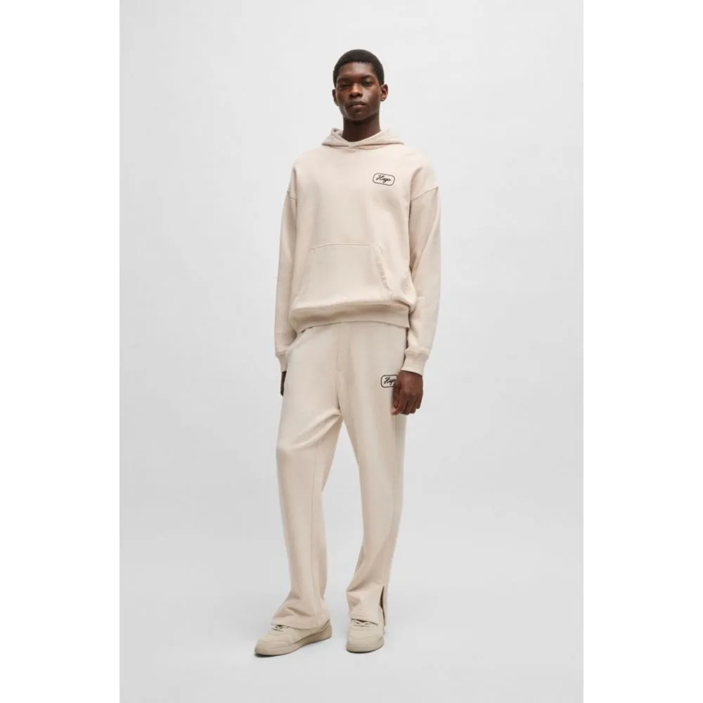 Cotton-terry tracksuit bottoms with embroidered graphics