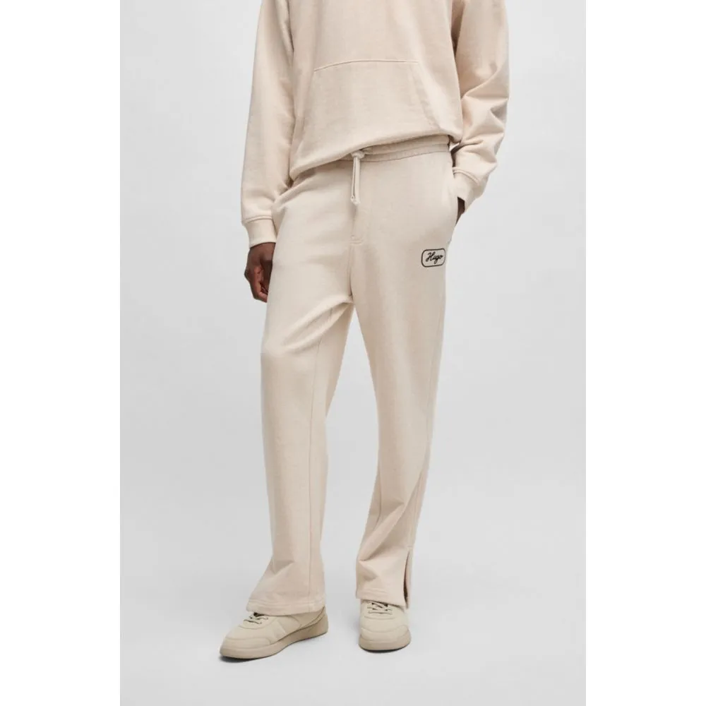 Cotton-terry tracksuit bottoms with embroidered graphics