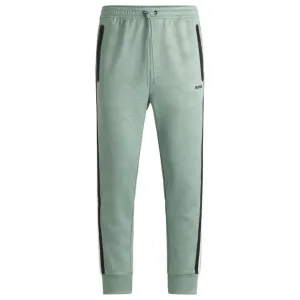 Relaxed-fit tracksuit bottoms with jacquard-woven circles