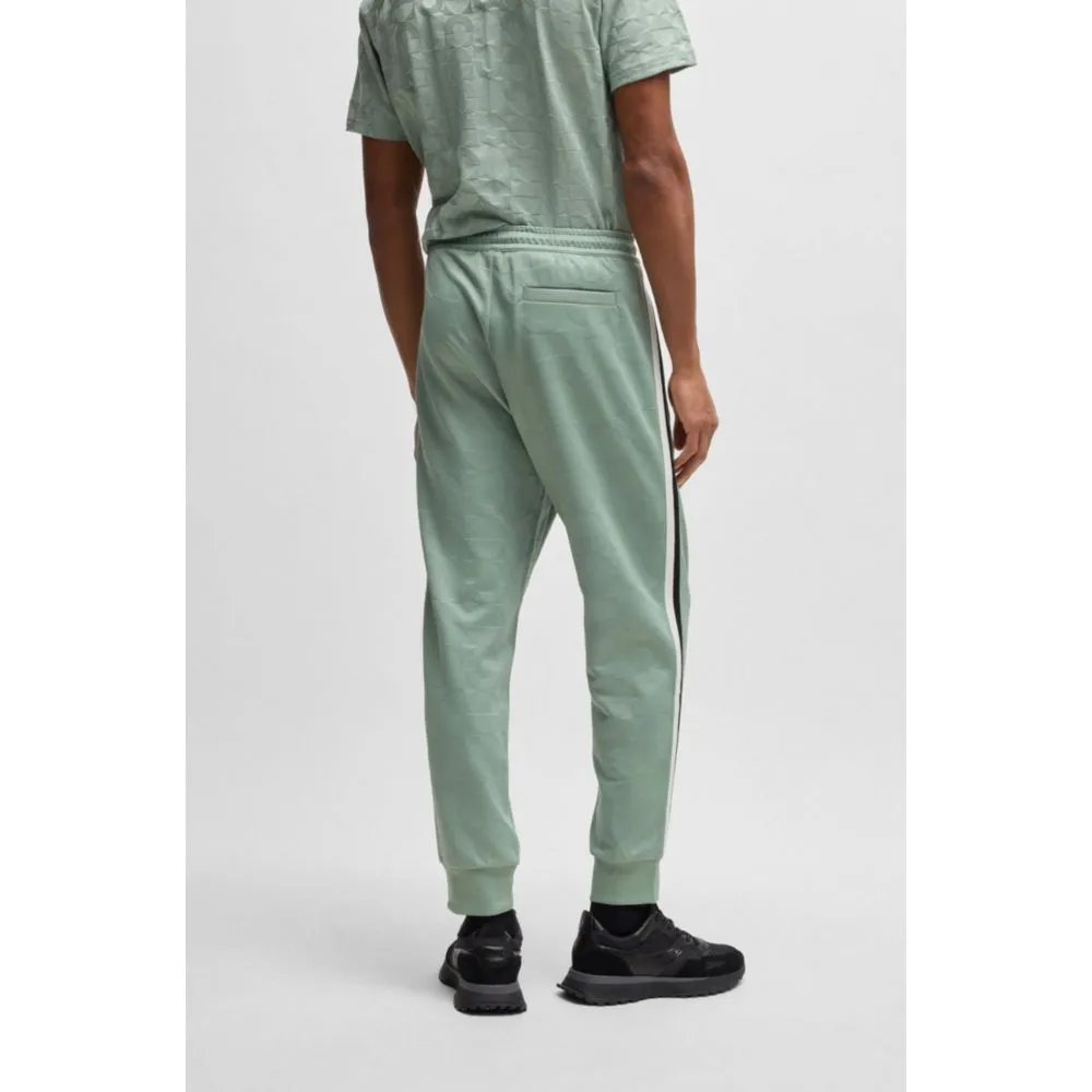 Relaxed-fit tracksuit bottoms with jacquard-woven circles